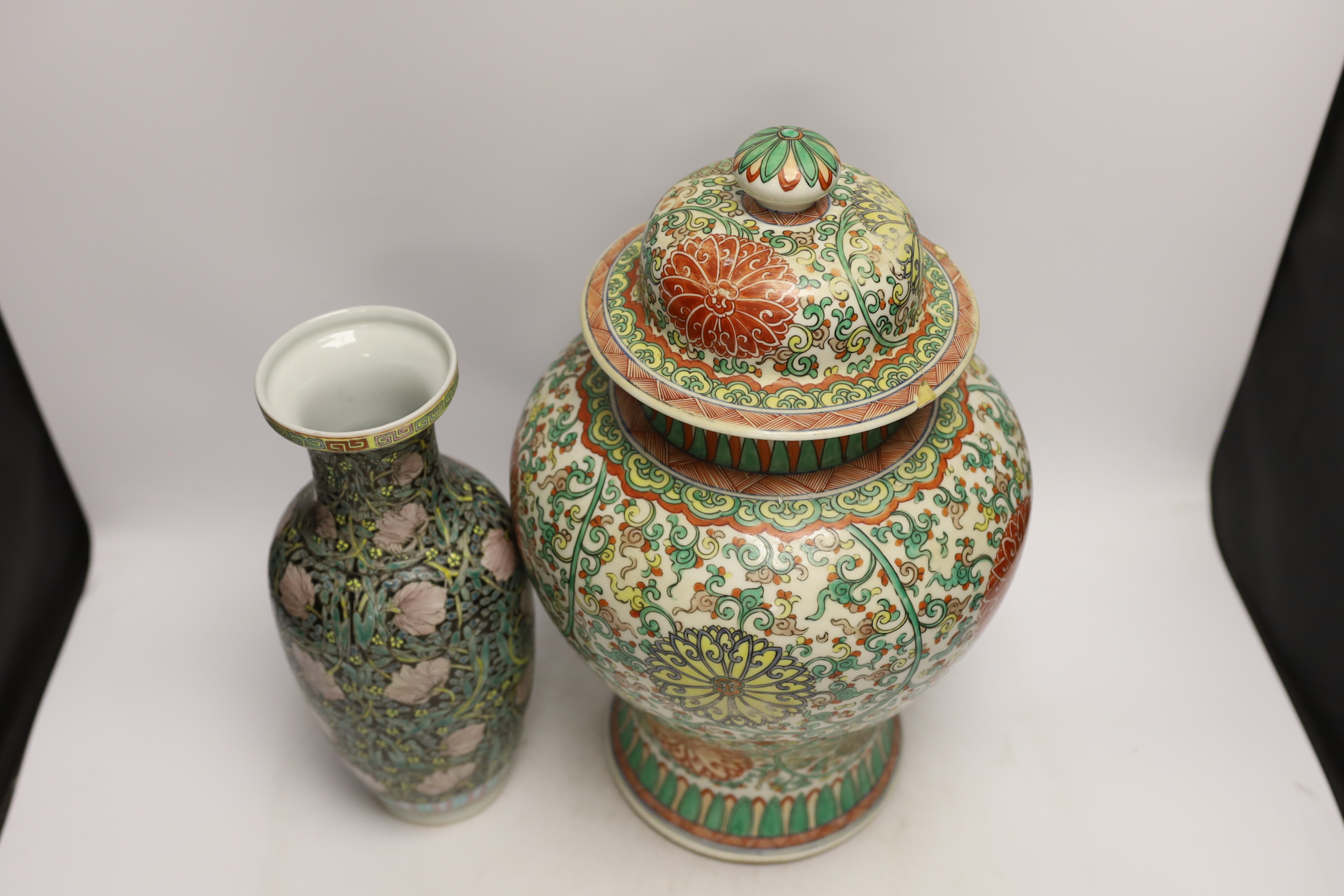 A large Chinese famille verte baluster jar and cover and a famille noir vase, tallest 40cm